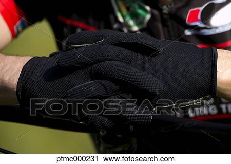 Stock Image - Mountain bike rider getting ready, Bologna, Italy. Fotosearch