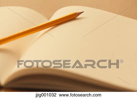 Stock Image - Notebook and pencil . Fotosearch