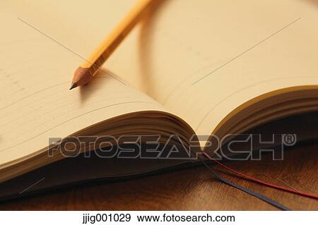 Notebook and pencil View Large Photo Image Stock Photo - Notebook and pencil . Fotosearch