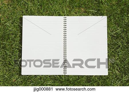 Notebook on grass View Large Photo Image Stock Image - Notebook on grass. Fotosearch