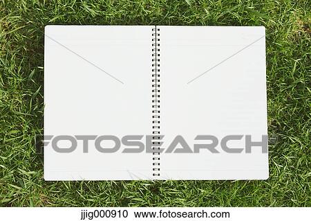 Notebook on grass View Large Photo Image Stock Image - Notebook on grass. Fotosearch
