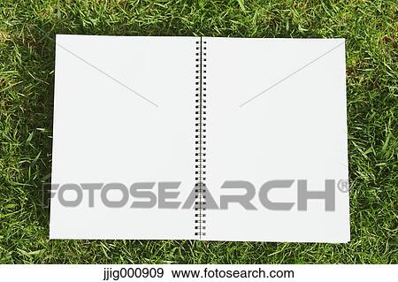 Notebook on grass View Large Photo Image Stock Photo - Notebook on grass. Fotosearch