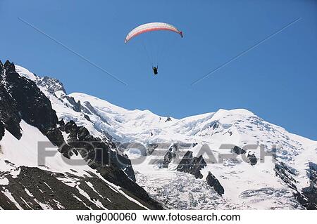 Stock Image - Paraglider Flying. Fotosearch