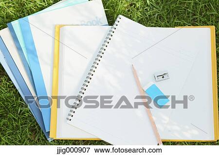 Pencil and notebooks on grass View Large Photo Image Stock Photo - Pencil and notebooks on grass. Fotosearch