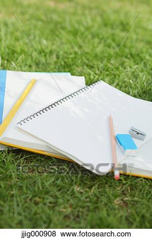 Pencil and notebooks on grass View Large Photo Image Stock Photo - Pencil and notebooks on grass. Fotosearch