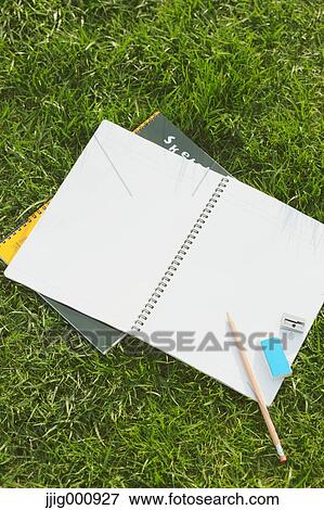 Pencil and notebooks on grass View Large Photo Image Stock Photo - Pencil and notebooks on grass. Fotosearch