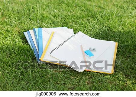Pencil and notebooks on grass View Large Photo Image Stock Photograph - Pencil and notebooks on grass. Fotosearch