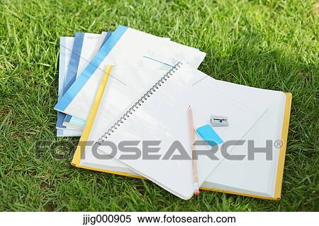 Pencil and notebooks on grass View Large Photo Image Stock Photography - Pencil and notebooks on grass. Fotosearch