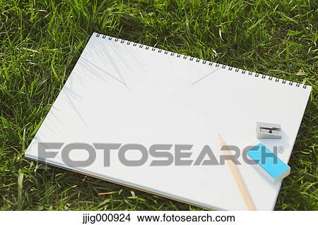 Pencil and sketchbook on grass View Large Photo Image Picture - Pencil and sketchbook on grass. Fotosearch