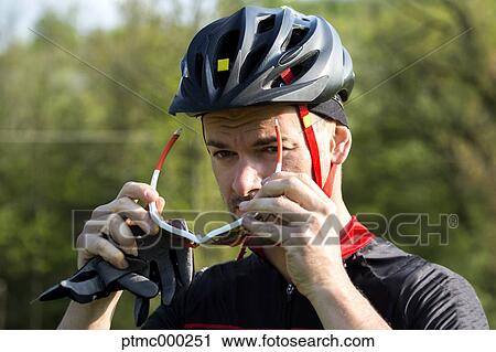 Stock Image - Portrait of mountain bike rider, Bologna, Italy. Fotosearch