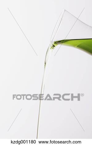 Stock Image - Pouring grape seed oil. Fotosearch