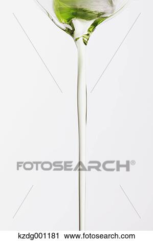 Stock Image - Pouring grape seed oil. Fotosearch