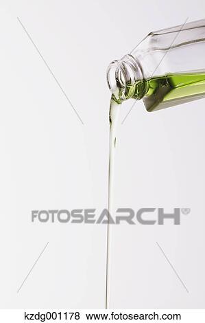 Pouring grape seed oil View Large Photo Image Stock Photo - Pouring grape seed oil. Fotosearch