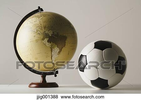 Soccer ball and globe View Large Photo Image Stock Photo - Soccer ball and globe. Fotosearch