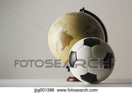 Soccer ball and globe View Large Photo Image Stock Photograph - Soccer ball and globe. Fotosearch