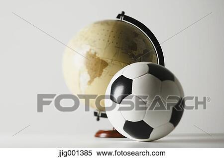 Soccer ball and globe View Large Photo Image Stock Photography - Soccer ball and globe. Fotosearch