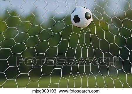 Stock Image - Soccer ball in the net. Fotosearch