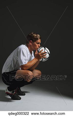 Soccer Player Crouching With Ball View Large Photo Image Stock Image - Soccer Player Crouching With Ball. Fotosearch