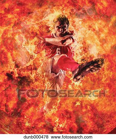 Stock Photo - Soccer Player Kicking In Mid-Air. Fotosearch