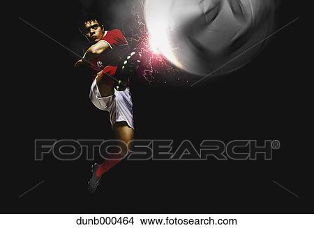 Soccer Player Kicking The Ball In Mid-Air View Large Photo Image Picture - Soccer Player Kicking The Ball In Mid-Air. Fotosearch