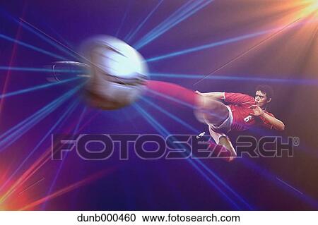 Soccer Player Kicking The Ball In Mid-Air View Large Photo Image Stock Image - Soccer Player Kicking The Ball In Mid-Air. Fotosearch