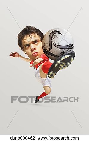 Soccer Player Kicking The Ball In Mid-Air View Large Photo Image Stock Image - Soccer Player Kicking The Ball In Mid-Air. Fotosearch