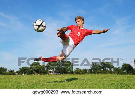 Soccer Player Kicking The Ball In Mid-Air View Large Photo Image Stock Image - Soccer Player Kicking The Ball In Mid-Air. Fotosearch