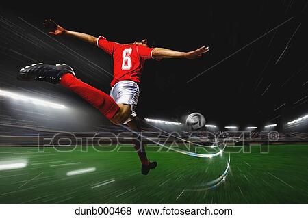 Soccer Player Kicking The Ball View Large Photo Image Stock Photo - Soccer Player Kicking The Ball. Fotosearch