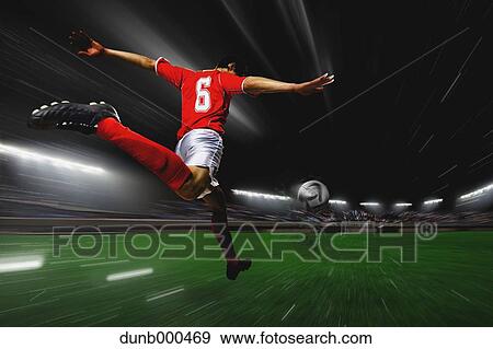 Soccer Player Kicking The Ball View Large Photo Image Stock Photo - Soccer Player Kicking The Ball. Fotosearch