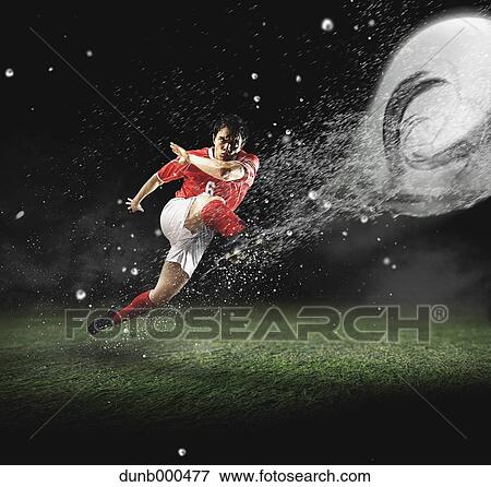 Soccer Player Kicking The Ball View Large Photo Image Stock Photo - Soccer Player Kicking The Ball. Fotosearch