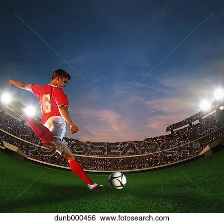Soccer Player Kicking The Ball View Large Photo Image Stock Photograph - Soccer Player Kicking The Ball. Fotosearch
