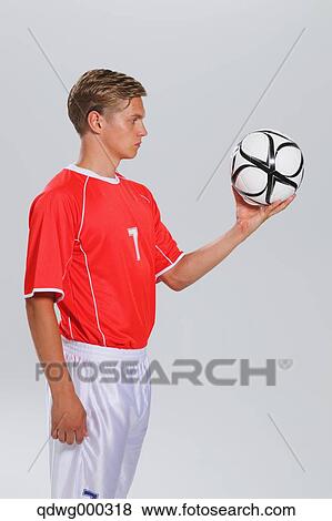 Stock Photo - Soccer Player Standing With Ball. Fotosearch