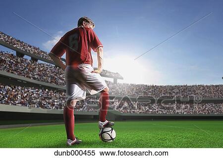 Stock Photography - Soccer Player Standing With Ball. Fotosearch