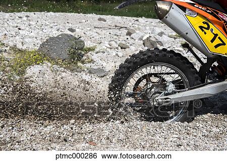 Spinning Enduro Bike Wheel on Stony Riverbed View Large Photo Image Stock Photograph - Spinning Enduro Bike Wheel on Stony Riverbed. Fotosearch