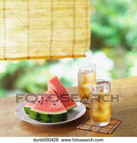 Stock Photo - Watermelon and barley tea . Fotosearch