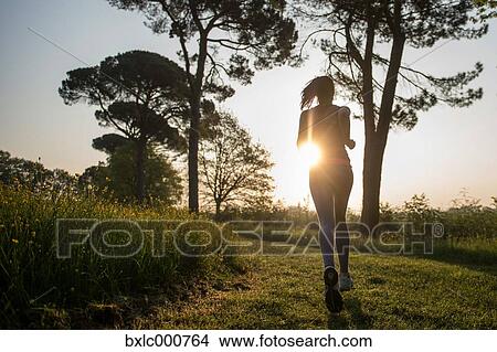 Young Girl Running In A Park View Large Photo Image Picture - Young Girl Running In A Park. Fotosearch