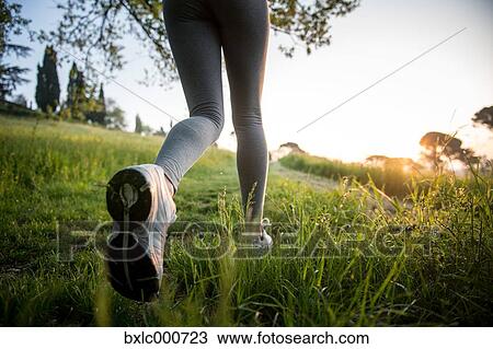 Young Girl Running In A Park View Large Photo Image Stock Image - Young Girl Running In A Park. Fotosearch