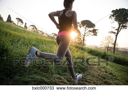 Young Girl Running In A Park View Large Photo Image Stock Image - Young Girl Running In A Park. Fotosearch