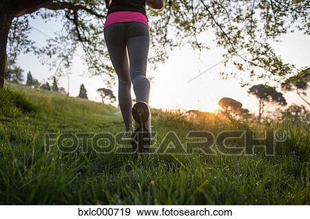 Young Girl Running In A Park View Large Photo Image Stock Photo - Young Girl Running In A Park. Fotosearch