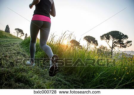 Young Girl Running In A Park View Large Photo Image Stock Photo - Young Girl Running In A Park. Fotosearch