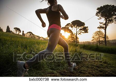 Young Girl Running In A Park View Large Photo Image Stock Photo - Young Girl Running In A Park. Fotosearch