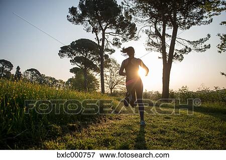 Young Girl Running In A Park View Large Photo Image Stock Photo - Young Girl Running In A Park. Fotosearch