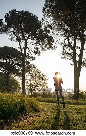 Young Girl Running In A Park View Large Photo Image Stock Photo - Young Girl Running In A Park. Fotosearch