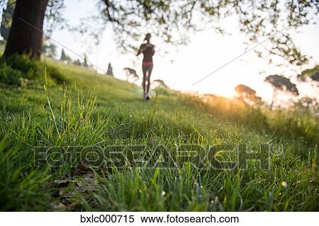 Young Girl Running In A Park View Large Photo Image Stock Photography - Young Girl Running In A Park. Fotosearch