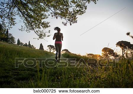 Young Girl Running In A Park View Large Photo Image Stock Photography - Young Girl Running In A Park. Fotosearch