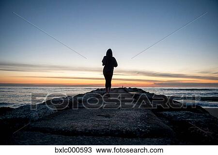 Stock Image - Young Girl Running On A Pier. Fotosearch