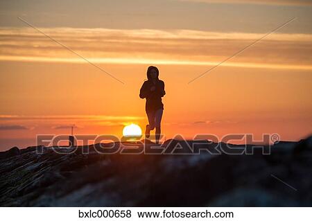 Stock Photo - Young Girl Running On A Pier. Fotosearch
