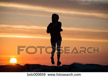Stock Photo - Young Girl Running On A Pier. Fotosearch