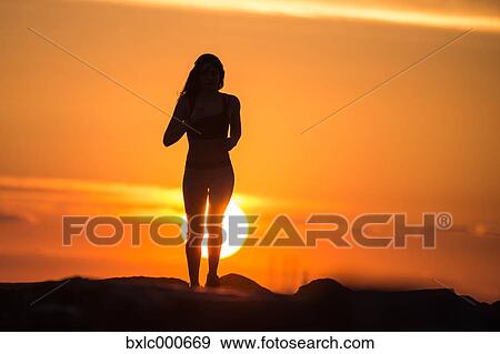 Stock Photo - Young Girl Running On A Pier. Fotosearch
