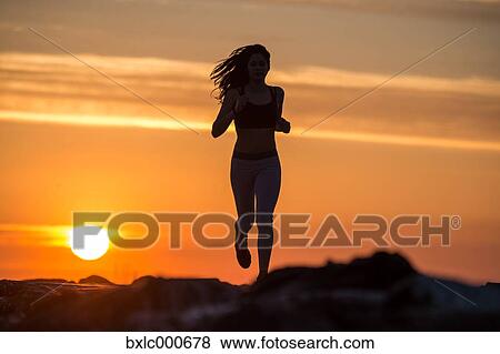 Stock Photo - Young Girl Running On A Pier. Fotosearch